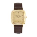 An 18ct gold automatic wristwatch by Omega, the cushion shaped gilt dial with baton markers and