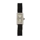 An Art Deco, platinum and diamond cocktail watch, the rectangular dial with Arabic numerals, to an