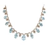 A late 19th century aquamarine and diamond necklace, composed of a fringe of graduated oval