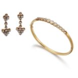 A cubic zirconia bangle and earrings, the hinged half-hoop bangle composed of a graduated line of