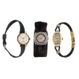 Three wristwatches, comprising: a lady's two colour gold example, the tonneau shaped dial with