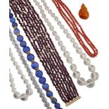A collection of bead necklaces, including: a coral, corallium rubrum, double-row; a polished