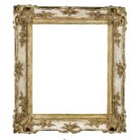 An English Gilded Composition Louis XV Style Swept and Pierced Frame, mid-19th century, with cavetto