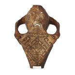 An Indonesian Belu-Atoni cow skull mask, incised all-over with geometric designs, 25cm long