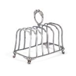 A French silver toast rack by André Aucoc, 1887-1911, with shaped partitions for six slices raised