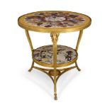 A gilt metal and specimen marble top two tier centre table, 20th century, the circular specimen