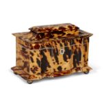 A George IV blond tortoiseshell and ivory two-division tea caddy, the interior with tortoiseshell