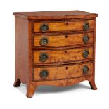 A Regency satinwood miniature bow-fronted chest, the four long drawers inlaid with ebony stringing