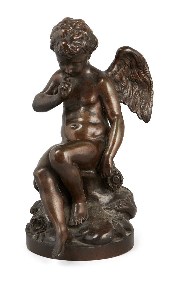 A French patinated bronze figure of seated cupid, in contemplation, signed and with foundry stamp H.