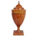 A George III decorated and crossbanded satinwood knife urn, with ebony and boxwood line stringing