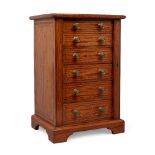 A late Victorian satinwood table-top Wellington chest jewellery cabinet, with six graduated line