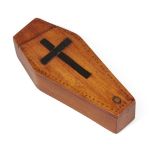 A miniature satinwood coffin-shape needle box, 19th century, the sliding top with cross