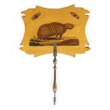 A decorated sycamore face screen, 19th century, with a printed armadillo, 31cm highPlease refer to