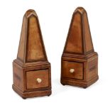 An unusual pair of George III small satinwood obelisk spice boxes, “Compasto” and “Fuimus”, each