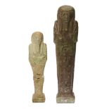 Two Egyptian green glazed composition shabtis carrying a pick and hoe, one of dark green with