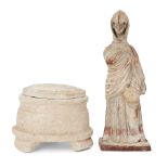 A reproduction Greek style ‘Tanagra’ figure, the standing female figure enveloped in a himation