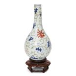 A Chinese porcelain doucai bottle vase, early 18th century, painted in doucai enamels with lotus