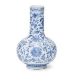 A Chinese porcelain 'lotus' small bottle vase, Qianlong mark and of the period, painted in