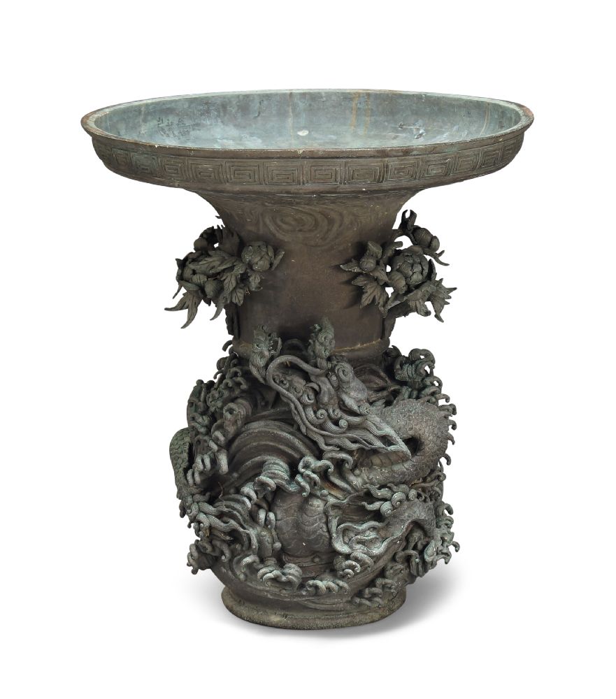 A large Japanese bronze vase, late 19th century, cast in high relief below the flared rim with a