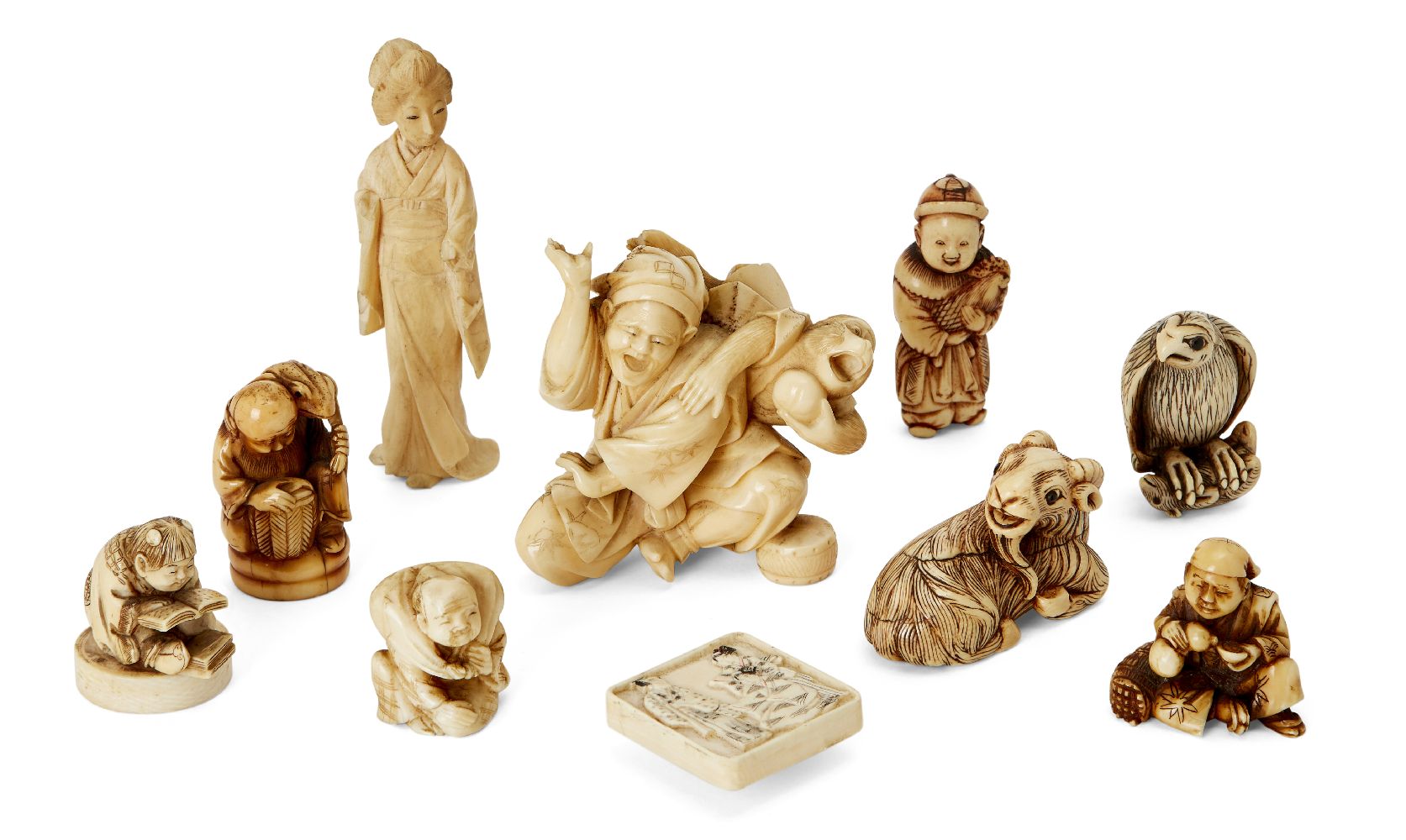 A group of Japanese ivory netsuke, 19th century, to include a recumbent ram; Gama Sennin seated with