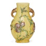 A Chinese aubergine and green-decorated yellow-ground vase, hu, 19th century, moulded to the body