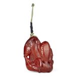 Property of a Gentleman (lots 36-85) A Chinese carved amber 'fish' pendant, Qing dynasty, late