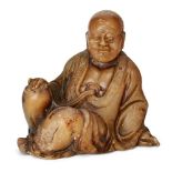 A Chinese soapstone carving of a Luohan, 18th/19th, century, finely carved in a seated pose with