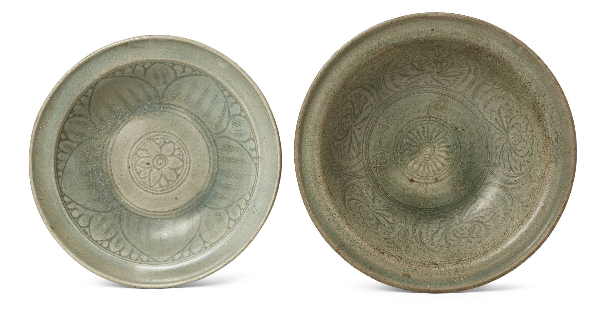 Two Thai Sawankhalok celadon pottery bowls, 15th century, one bowl decorated to the interior with an