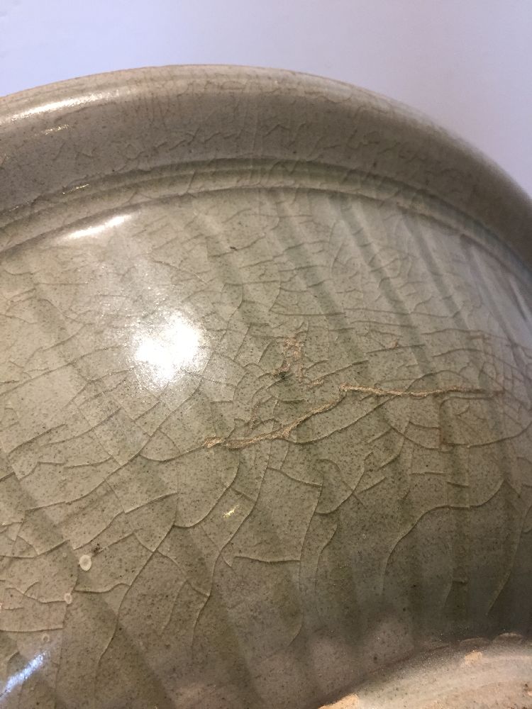 Two Thai Sawankhalok celadon pottery bowls, 15th century, one bowl decorated to the interior with an - Image 8 of 17