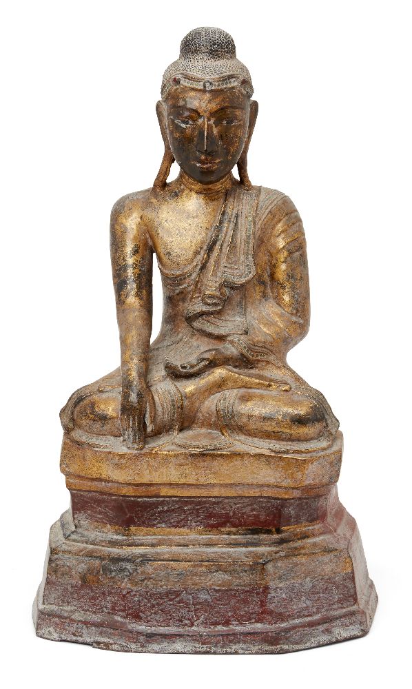 A Burmese lacquered and gilded papier mâché seated Buddha, Mandalay period, 19th century, his