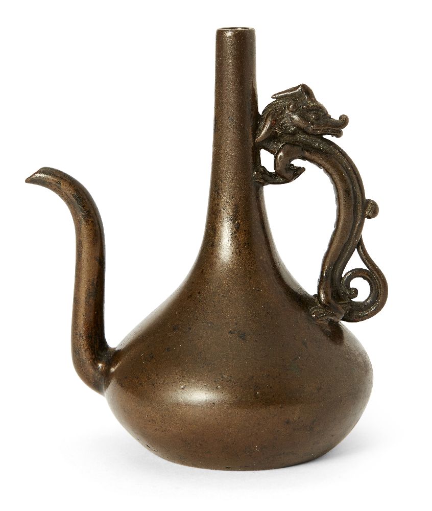 A Japanese bronze water dropper, 18th century, cast as a ewer with an elongated neck and an