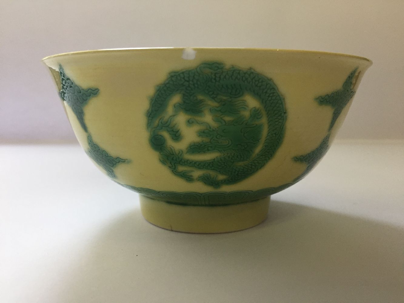 A Chinese porcelain yellow-ground green-enamelled 'dragon medallion' bowl, Kangxi mark and of the - Image 14 of 21