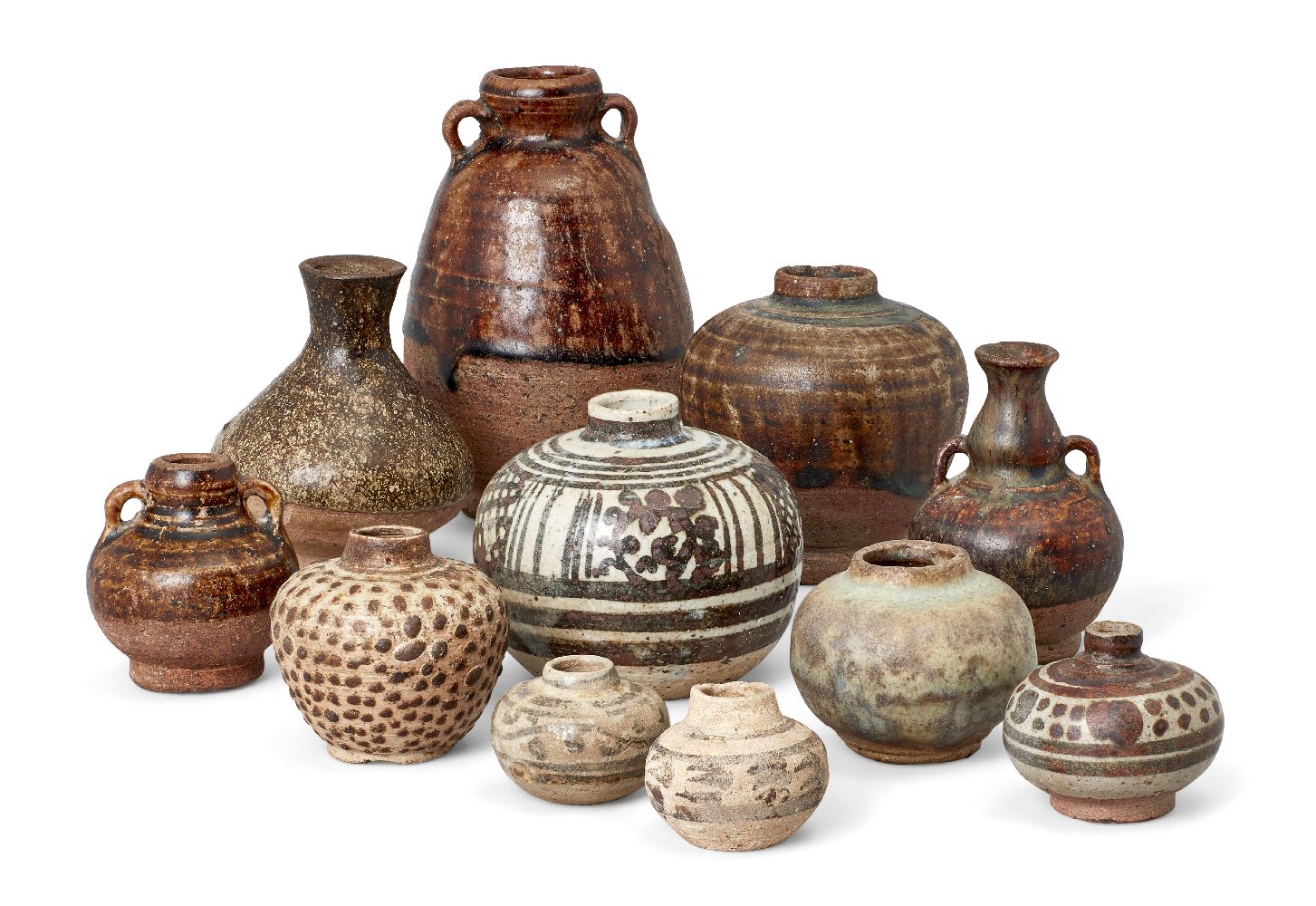 Eleven Thai Sawankhalok jarlets/miniature vases, 14th-15th century, five treacle-glazed, 11-3cm high