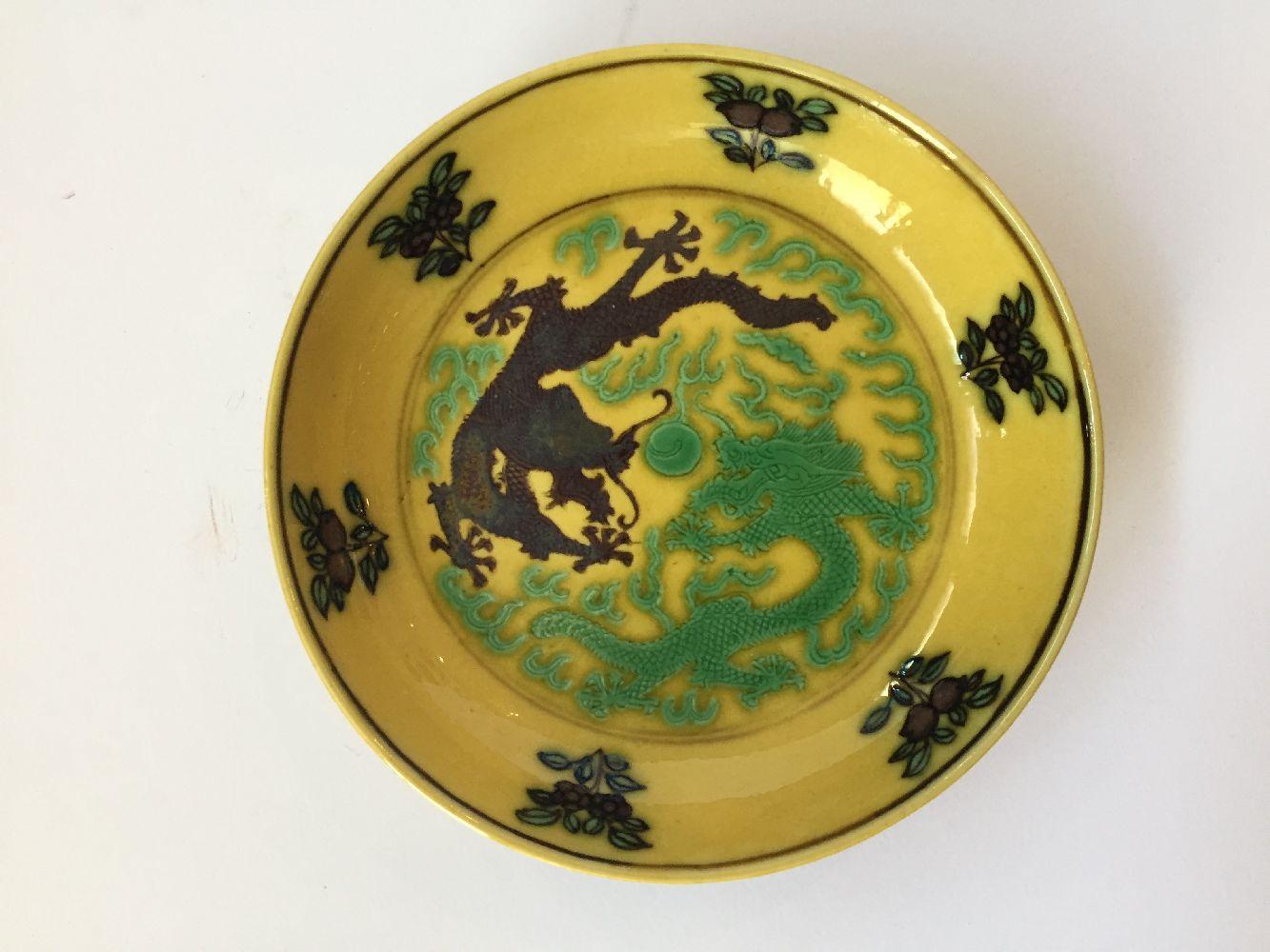 A Chinese small yellow-ground aubergine and green-decorated porcelain saucer dish, Guangxu mark - Image 4 of 12