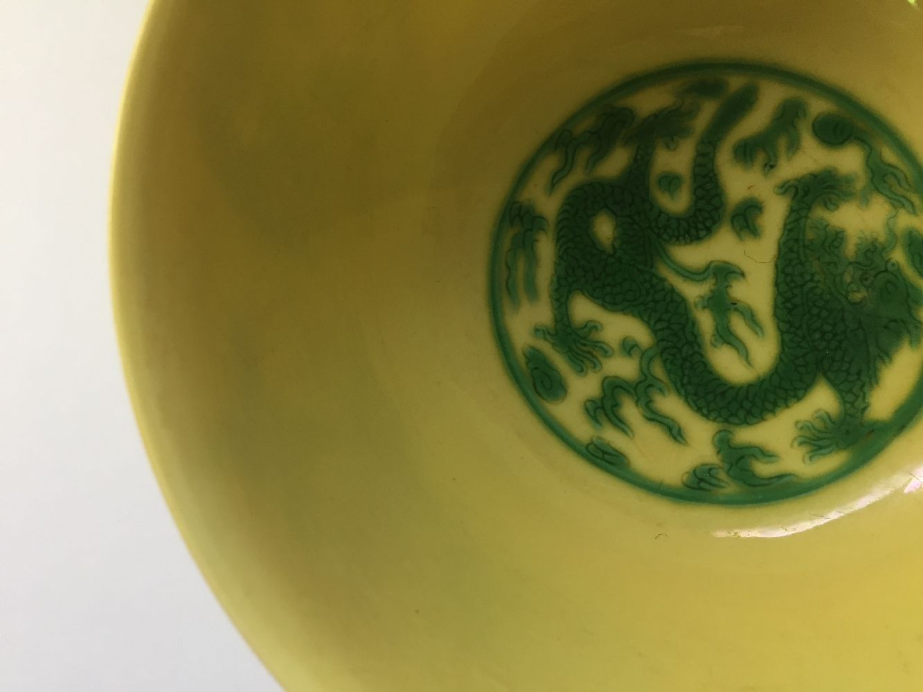 A Chinese porcelain yellow-ground green-enamelled 'dragon medallion' bowl, Kangxi mark and of the - Image 21 of 21