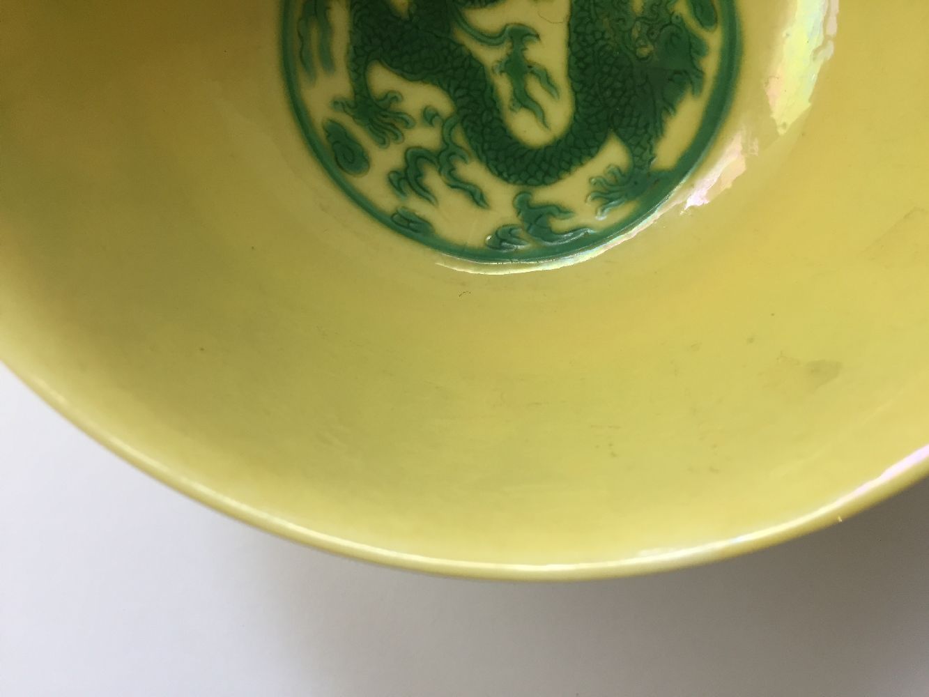 A Chinese porcelain yellow-ground green-enamelled 'dragon medallion' bowl, Kangxi mark and of the - Image 20 of 21