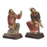 Two Chinese painted stucco figures, 17th/18th century, modelled as a man and a woman kneeling