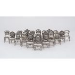 A set of 24 pewter place card holders, each designed as a chair with card aperture to reverse, in