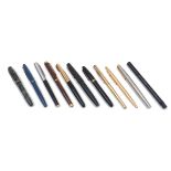 A group of pens including: a Waterman Ideal brown marbled fountain pen with 18k gold nib; a Duro