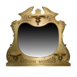 A gilt wall mirror, late 20th century, with broken pediment top and serpentine shelf above shaped