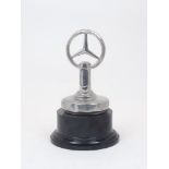 A chromium plated Mercedes-Benz desk ornament, 20th Century, modelled after the radiator cap for the