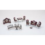 A suite of Viennese white metal filigree miniature furniture, 20th Century, to include a settee,