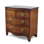 A mahogany and crossbanded serpentine chest of drawers, late 19th/early 20th century, with