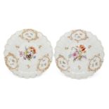 A pair of Meissen cabinet plates, 19th Century, each decorated with Deutsche Blumen to the centre