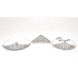Two crystal tiaras together with a similar crystal tiara on a comb, all of similar 'Empire-style'