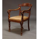 A William IV mahogany armchair, the shaped bar back with carved gadroon and scrolling decoration