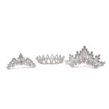 A collection of five crystal-set tiaras on combs comprising: a butterfly-design Swarovski crystal