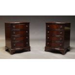 A pair of George III style mahogany serpentine chests, late 20th Century, each with four long