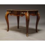 A Louis XV style walnut, kingwood gilt metal mounted bureau plat, late 20th Century, the shaped