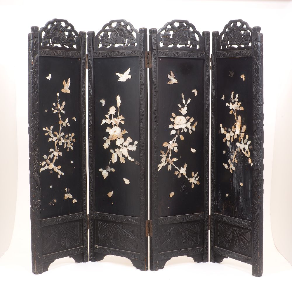 A Japanese carved hardwood shibayama style three-fold screen, early 20th Century, the panels